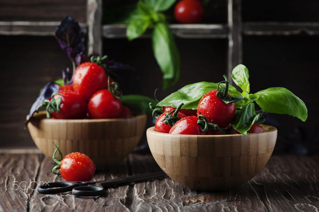 Concept of healthy eating with tomato and basil, selective focus